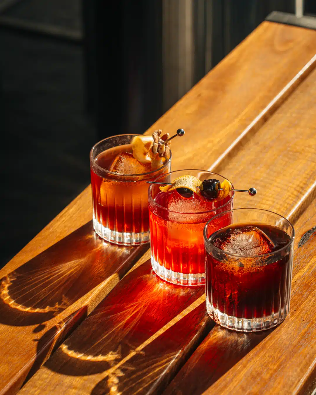 Drink photography of three negroni cocktails from a bar marketing campaign.