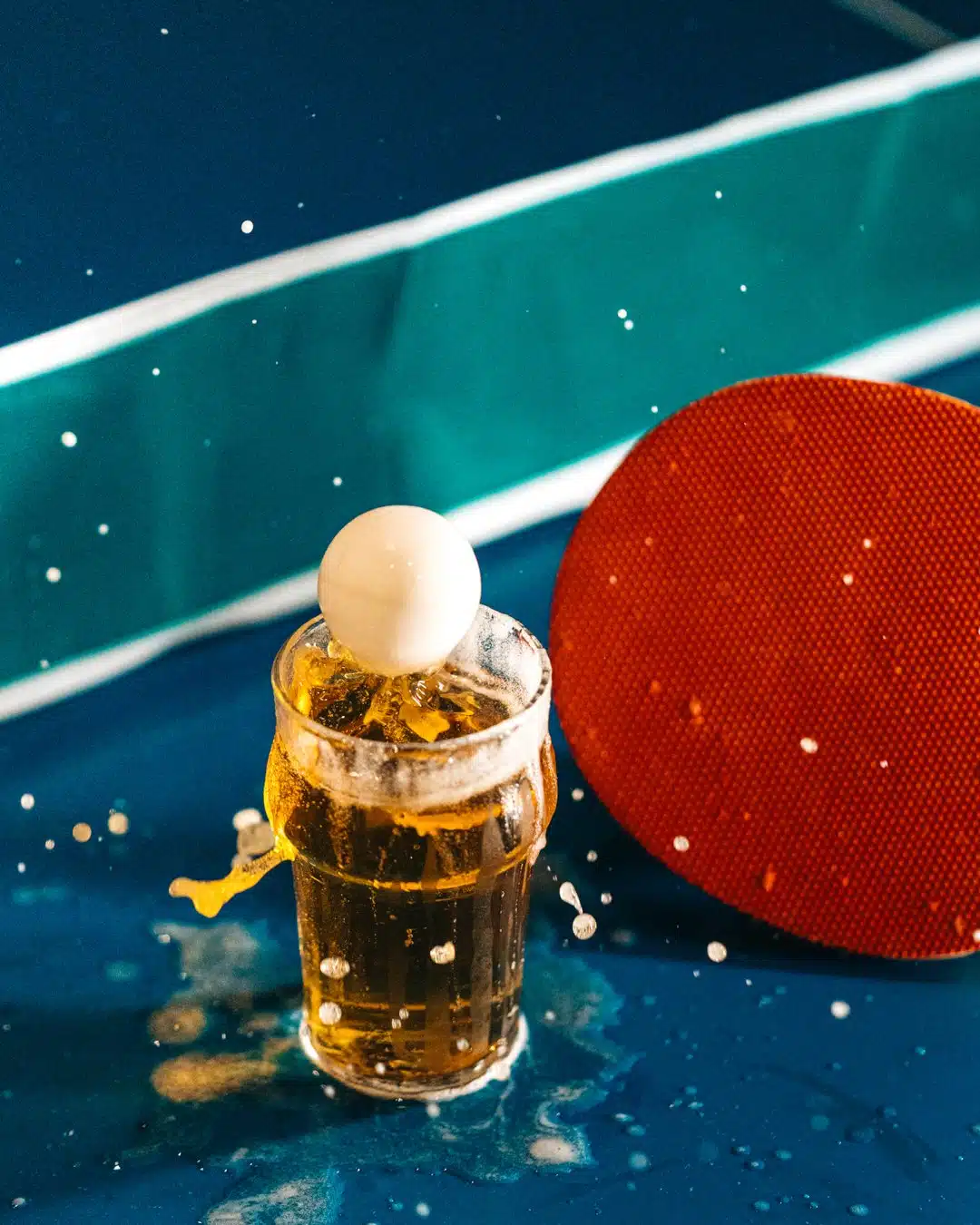 Drink photography of a ping pong ball landing into a beer from a bar marketing campaign.
