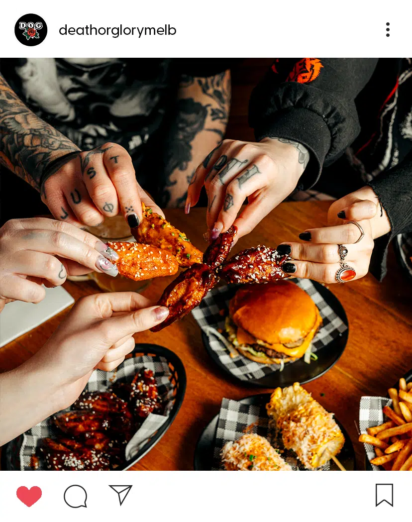 Food photography shot of hands holding chicken wings used in a social media marketing campaign for a bar on Instagram