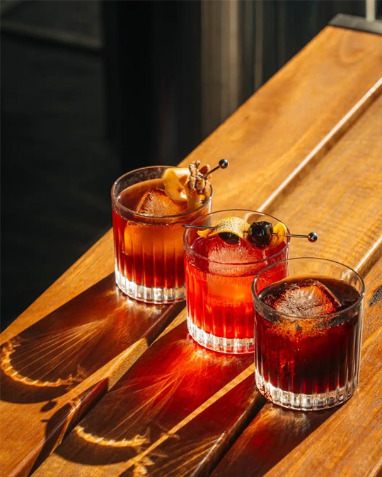 Drink photography of three negroni cocktails from a bar marketing campaign.