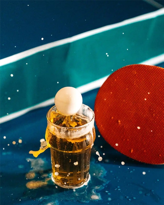 Drink photography of a ping pong ball landing into a beer from a bar marketing campaign.